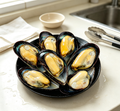 Freshly steamed mussels with golden flesh