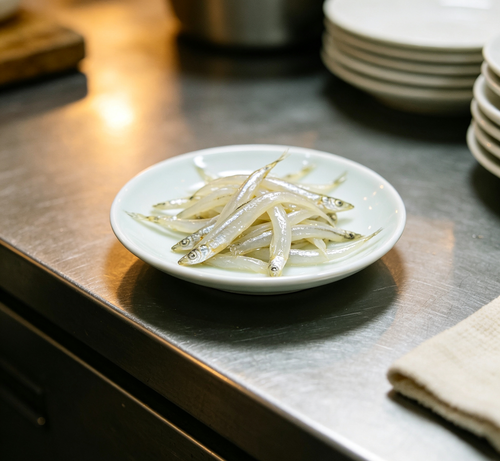 Fresh silver fish arranged on a plate